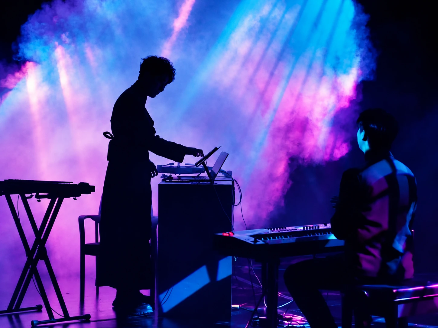Electronic performance against a purple and blue projection